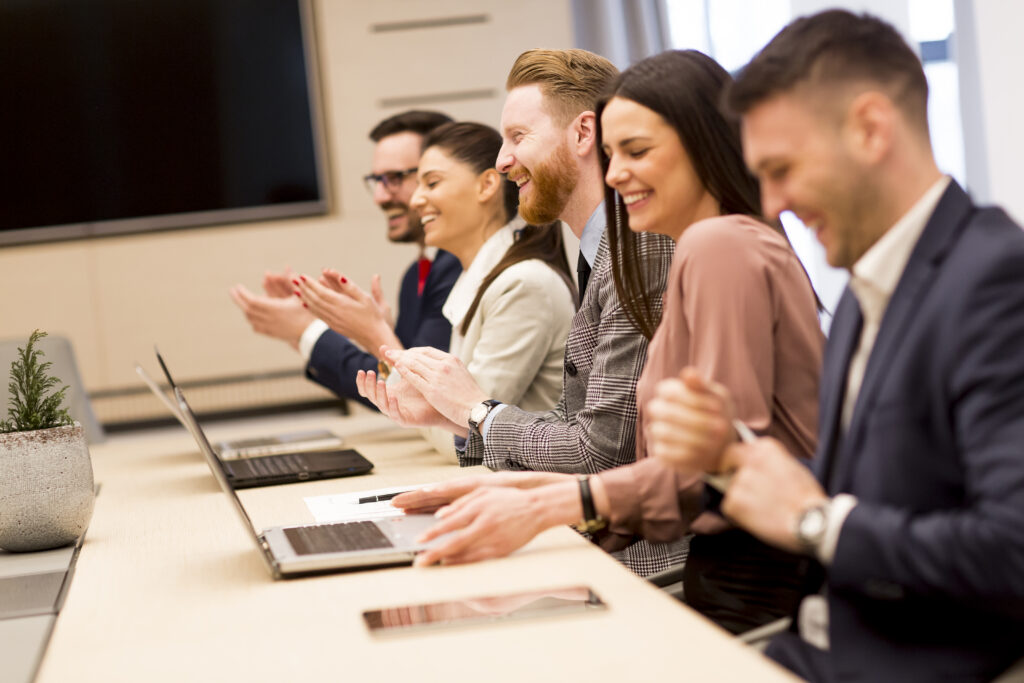 Ambitious professionals participating in a sales and marketing training session.